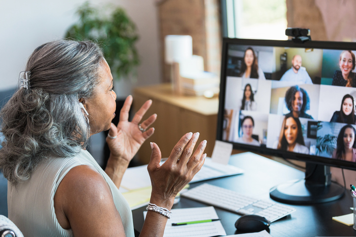 Woman at desk on video conference call